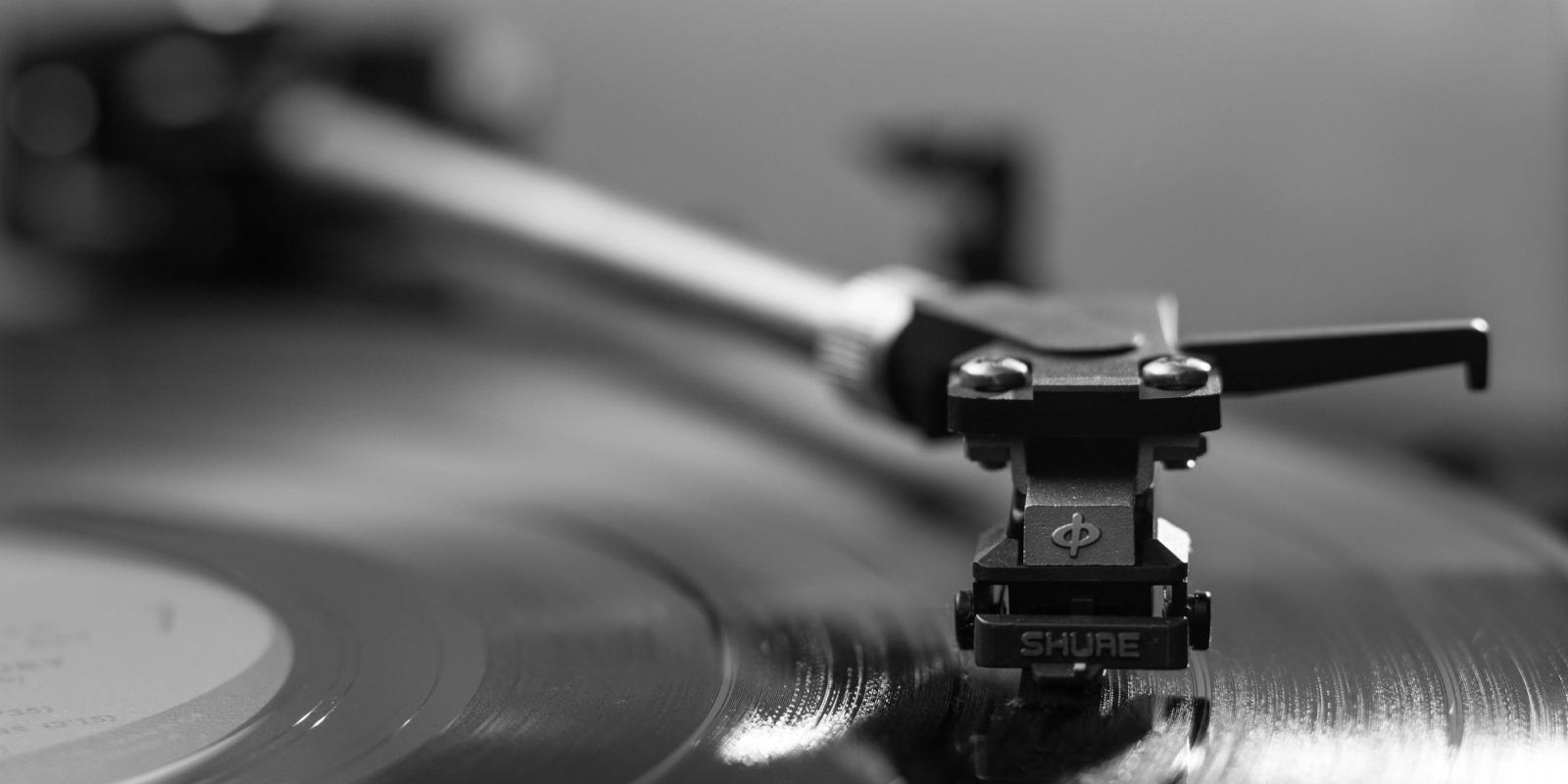 Record player needle playing a vinyl record